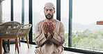 Muslim, man and praying salah in home with faith, praise Allah and spiritual worship in Ramadan. Islamic, male person and prayer with dua, religious practice and devotion to God for belief in lounge