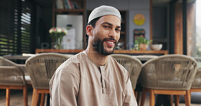 Buy stock photo Muslim, smile and man in house with portrait, positive attitude or calm in Ramadan tradition. Islam, happy or male person in living room with peace, resting or religious connection during Eid Mubarak
