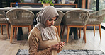 Muslim, woman and praying in home for faith, religion and meditation on Ramadan Kareem for peace. Islam, holy prayer and person worship God with spiritual devotion, salah and praise Allah in house