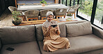 Muslim woman, phone and streaming on sofa for movie, subscription app or watch series for entertainment. Film website, video platform and happy person with hijab in home, mobile and relax from above