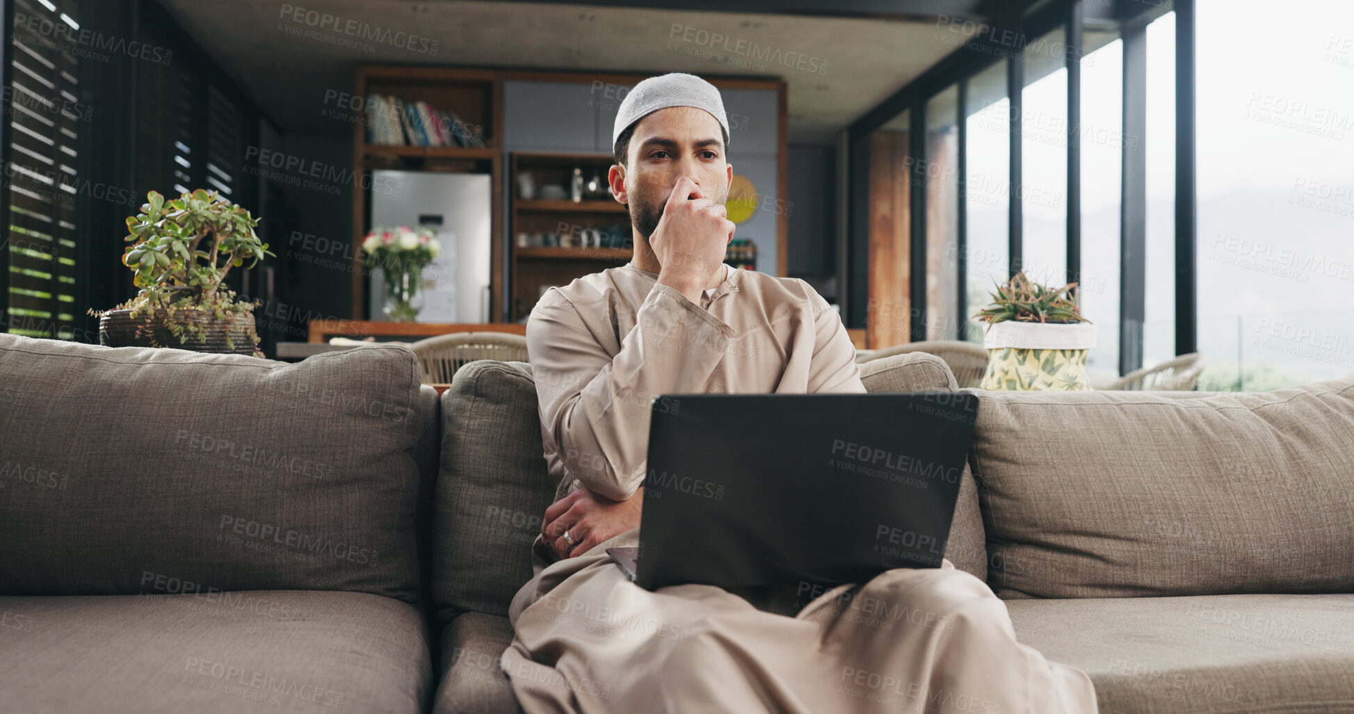 Buy stock photo Muslim man, laptop and decision with remote work from home for thinking, review or project management in lounge. Islamic person, computer and insight for proposal, feedback and freelance job in house