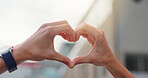 Heart hands, love and support with man in city for community, gratitude and kindness gesture. Forgiveness, peace and trust with closeup of person outdoor for hope, compassion and care symbol