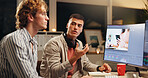 Men, talking and computer screen for video editing in office with advice for content creation at night. People, chat and pc for filmmaking feedback, creative teamwork and working late for production