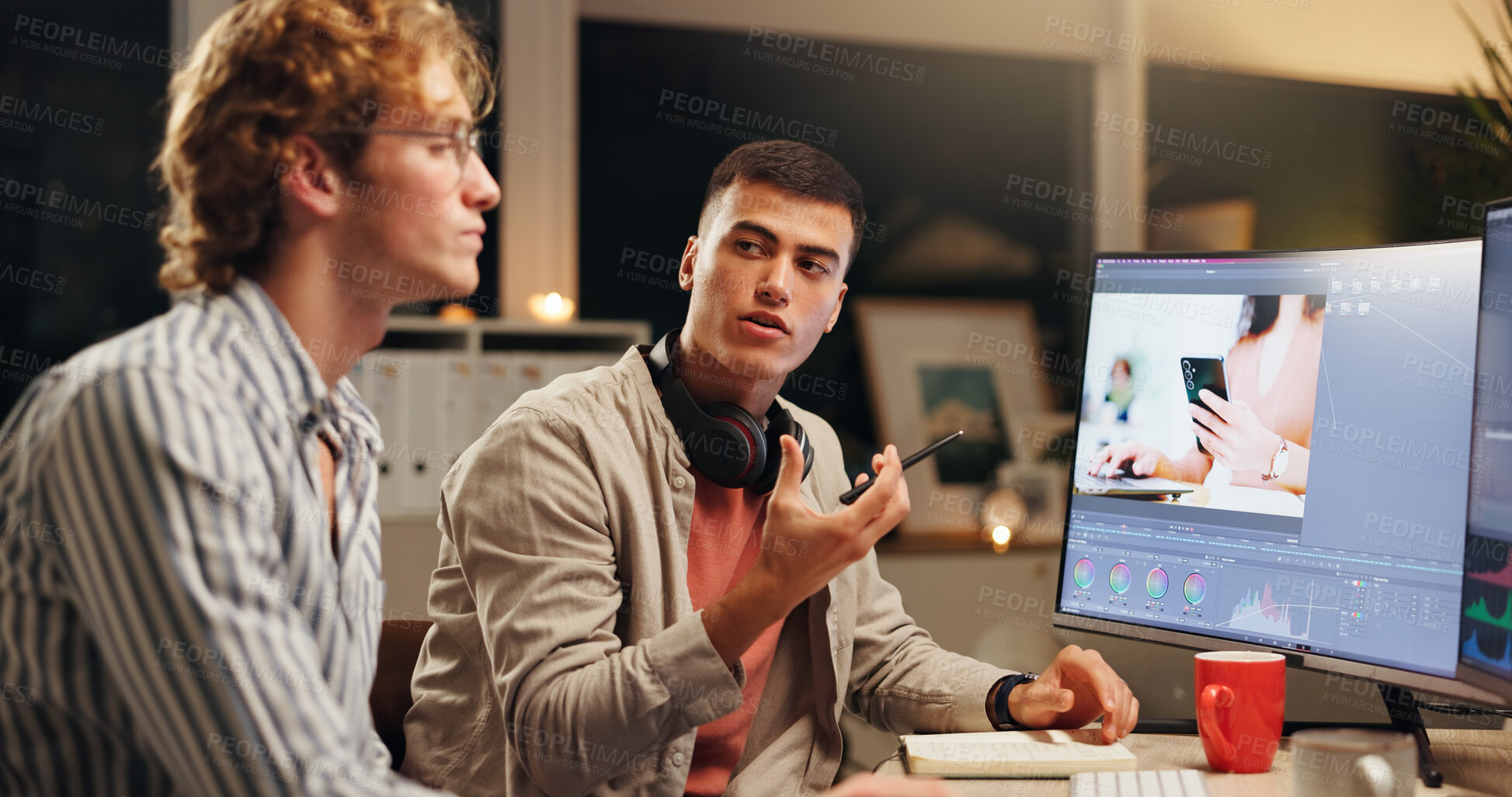 Buy stock photo Men, talking and computer screen for video editing in office with advice for content creation at night. People, chat and pc for filmmaking feedback, creative teamwork and working late for production
