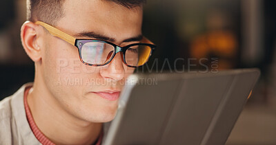 Buy stock photo Night, man and glasses in office with tablet, reading insights and ad performance for digital marketing. Late, person and review in workplace with tech, planning and campaign results for advertising.