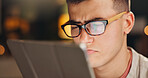 Night, tablet and man with glasses, reflection and online reading for web development. Evening, eyewear or person with tech, internet or digital app for programming, review stats or report for coding