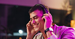 Smile, man and headphones in home at night for streaming podcast, listening to music and weekend. Happy, male person and evening with groovy audio, radio sound and subscription for playlist update