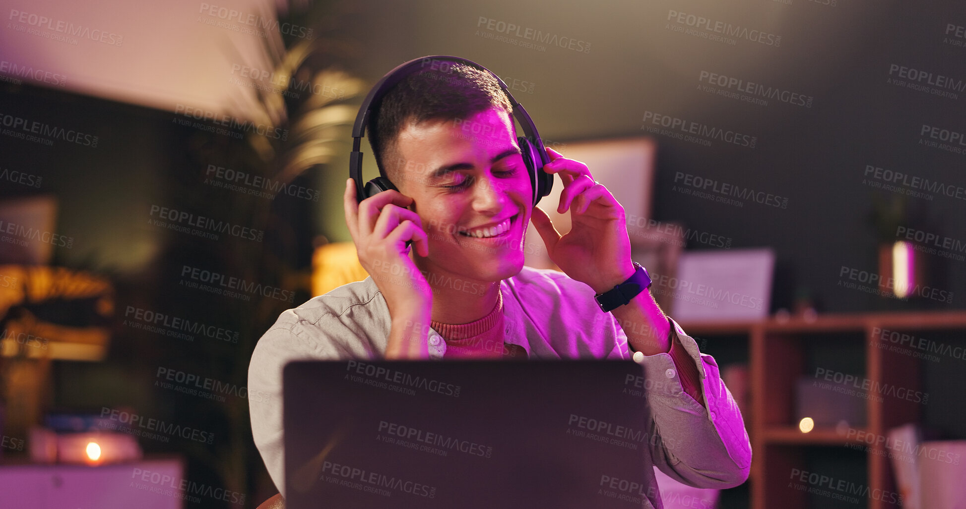 Buy stock photo Creative, laptop and man with headphones, office and happy with sound, listening and post production. Editing, music and audio engineer with tech for project, online and person with deadline at night