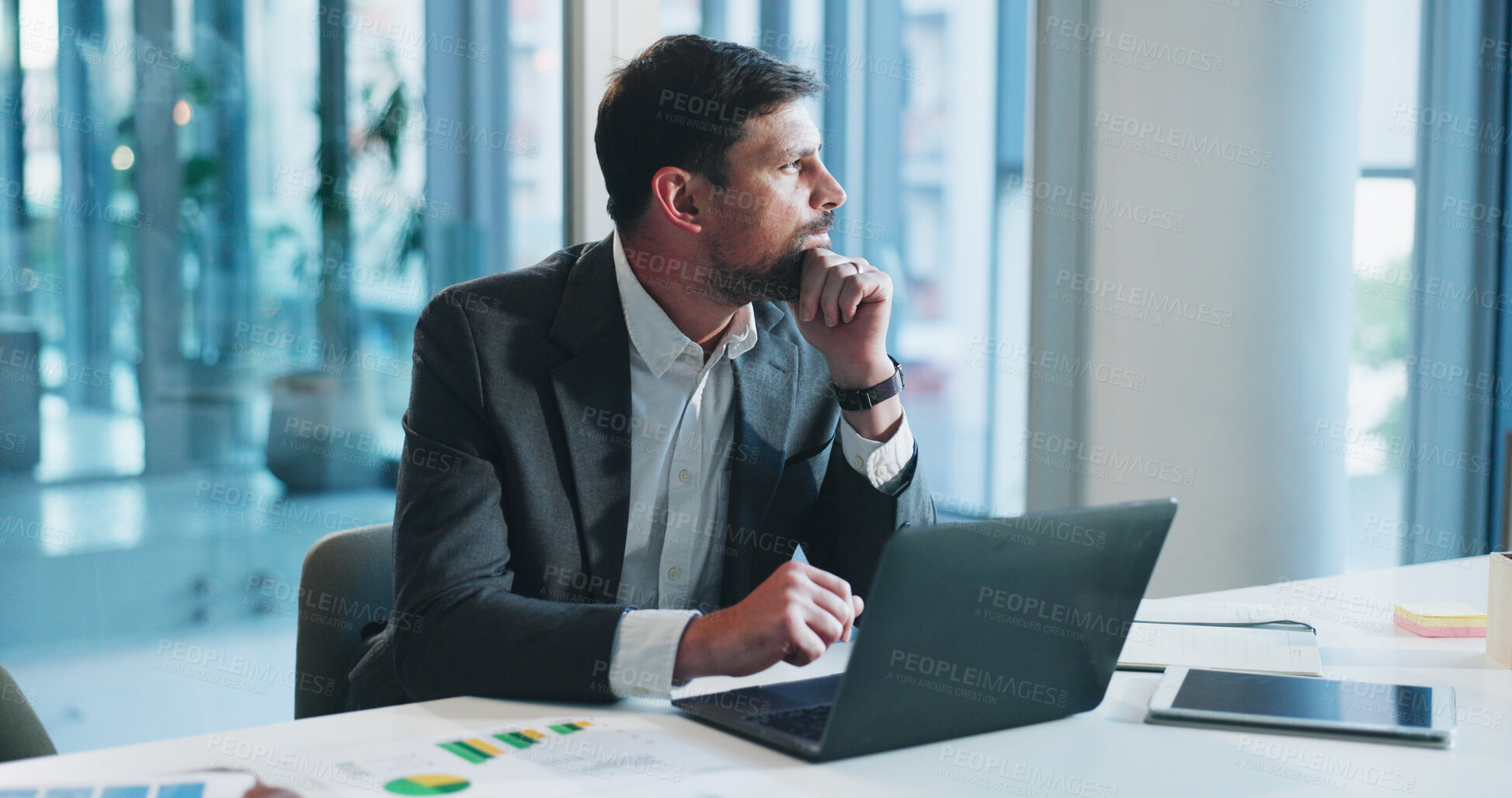 Buy stock photo Man, accounting and thinking with laptop at office for review, charts and documents at company. Person, computer and decision with bookkeeping, administration and revenue graphs at financial agency