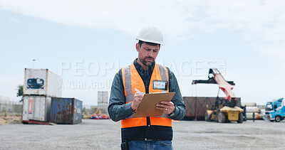 Buy stock photo Man, logistics and writing with clipboard in yard for shipping control or supply chain safety. Male person, inspection or storage operator with inventory check or container checklist for distribution