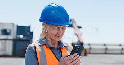 Buy stock photo Construction site, reading or woman with phone for inspection, infrastructure or building schedule info. Review, project timeline or mature manager with development notes on mobile, outdoor or update