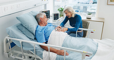 Buy stock photo Happy, old couple and conversation by hospital bed for support, compassion or empathy for recovery. Married, elderly people and smile in medical clinic with care, chat or good news for health update.