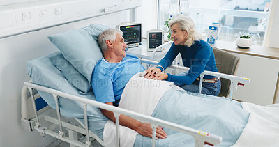 Buy stock photo Old couple, smile and holding hands by hospital bed with support, kindness or empathy for recovery. Married, elderly people and happy in medical clinic with care, chat or good news for health update.