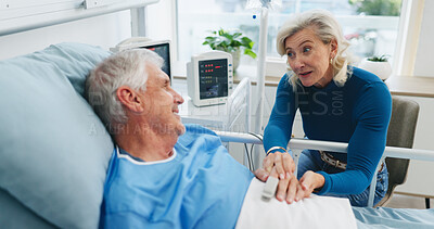 Buy stock photo Old couple, advice and holding hands by hospital bed with support, kindness or empathy for recovery. Married, elderly people and love in medical clinic with compassion, conversation or health update.