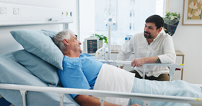 Buy stock photo Senior patient, son and communication in hospital for visit, emotional support and check up for healing. Care, comfort and elderly father with man for health recovery, chat and love in medical center