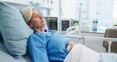 Buy stock photo Tired, senior woman and sleeping in hospital bed for rest, healthcare recovery and treatment. Elderly person, fatigue and exhausted patient with illness, medical rehabilitation and asleep for healing