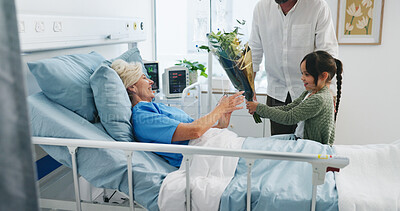 Buy stock photo Grandmother, child and parent with flowers in hospital, get well soon gift and family visit for healing. Healthcare, senior woman and people with bouquet for medical recovery support, love or present