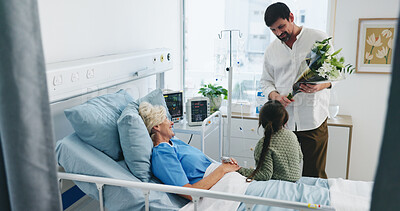 Buy stock photo Grandmother, child and father with flowers in hospital, get well soon gift and family visit for healing. Healthcare, senior woman and people with bouquet for medical recovery support, love or present