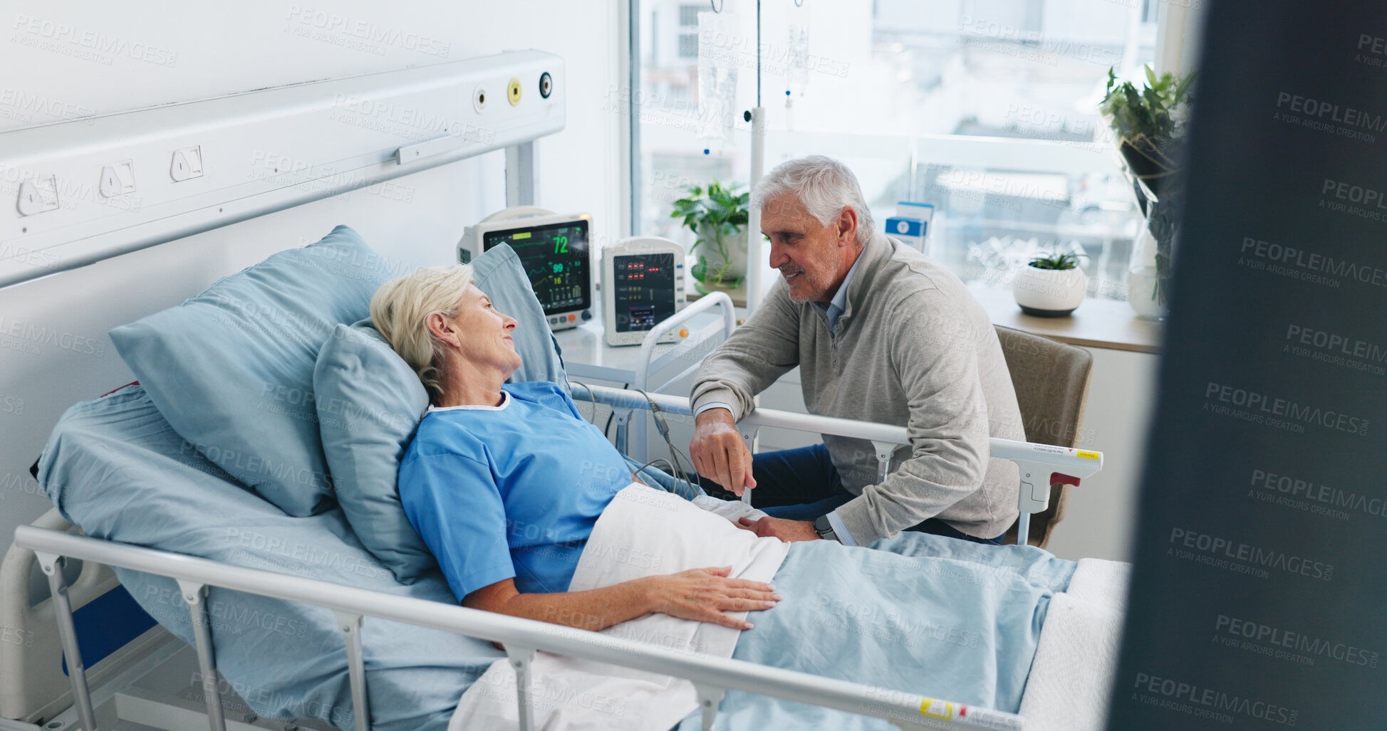 Buy stock photo Old couple, trust and holding hands by hospital bed with support, kindness and empathy for recovery. Married, elderly people and care in medical clinic with compassion, conversation or health update.