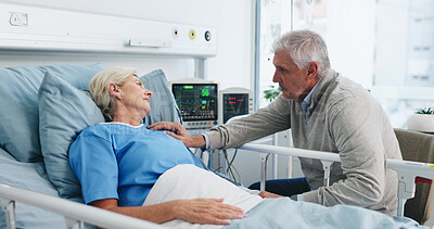 Buy stock photo Old couple, support and visit by hospital bed with empathy, kindness and update for surgery recovery. Married, elderly people and conversation in medical clinic with love, care and hope for healing.