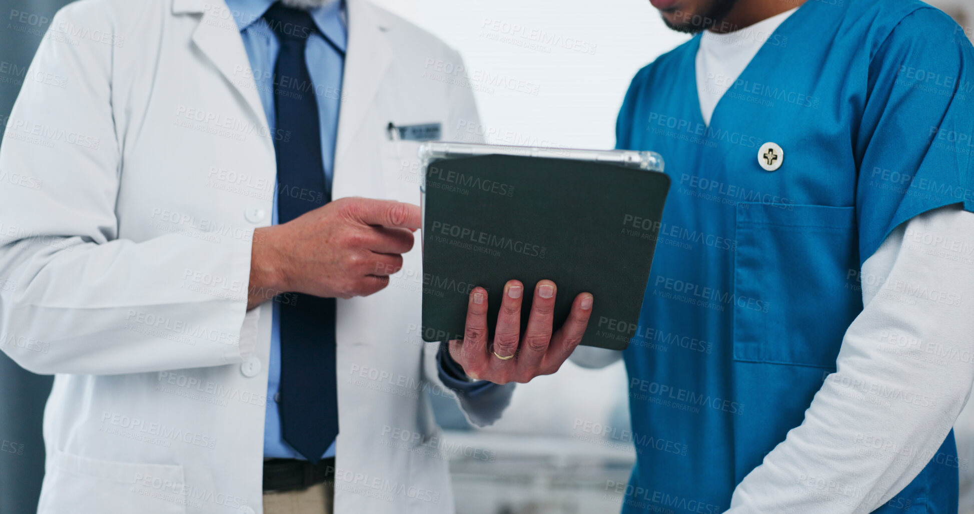 Buy stock photo Hands, doctors and tablet for discussion at hospital for team review, checklist or insight for medical report. People, nurse and surgeon with tech, app and feedback for healthcare services at clinic