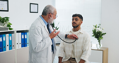 Buy stock photo Doctor, man and listen in office with stethoscope, heart assessment and cardiology exam for advice. People, healthcare worker and patient breathe in clinic with equipment, chest evaluation and help.