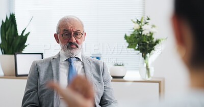 Buy stock photo Therapy, session and man with client, office and listening to story, consultation and mental health. Serious, mature psychologist and person with depression in clinic, talking and counseling services