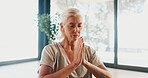 Mature woman, meditation and namaste at yoga studio with mudra for breathing exercise in gym. Person, holistic fitness and mindfulness at club, class or prayer hands pose for peace at wellness center