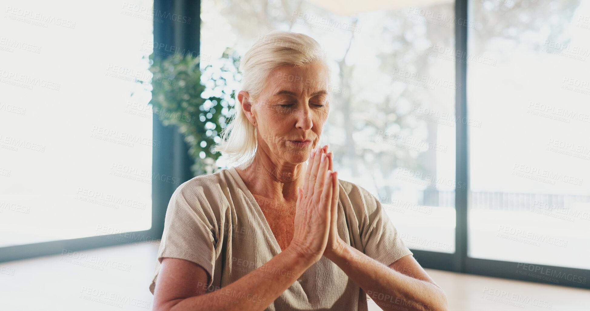 Buy stock photo Mature woman, meditation and namaste at yoga studio with mudra for breathing exercise in gym. Person, holistic fitness and mindfulness at club, class or prayer hands pose for peace at wellness center