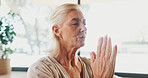 Mature woman, zen and namaste at yoga studio with mudra for breathing exercise in gym. Person, holistic fitness and mindfulness at club, class or prayer hands pose for meditation at wellness center