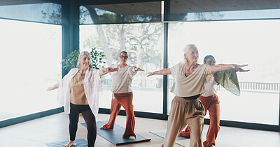 Buy stock photo Mature woman, warrior pose and group in yoga class for holistic fitness, zen or course at studio. People, meditation coach and mindfulness with guide, breathing exercise or balance at wellness club