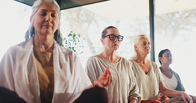 Buy stock photo Yoga, woman and group meditation in class for holistic wellness, spiritual healing and inner peace. Calm people, mature person and mindfulness practice in studio for mental health and stress relief