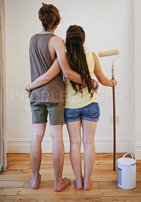 Buy stock photo Couple, wall and painting in home for improvement together in new apartment for diy maintenance, decoration or renovation. Man, woman and back or roller for house project repair, makeover or crafting