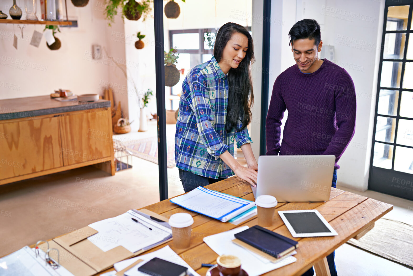 Buy stock photo Creative people, laptop and planning with team for project, documents or networking together at the office. Happy man and woman working on computer with paperwork for online research at workplace