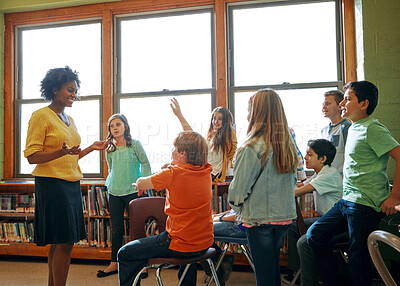 Buy stock photo Learning, education and student with questions for teacher in middle school classroom. Library, scholarship group and male learner raising hand to answer question, studying or help with black woman.
