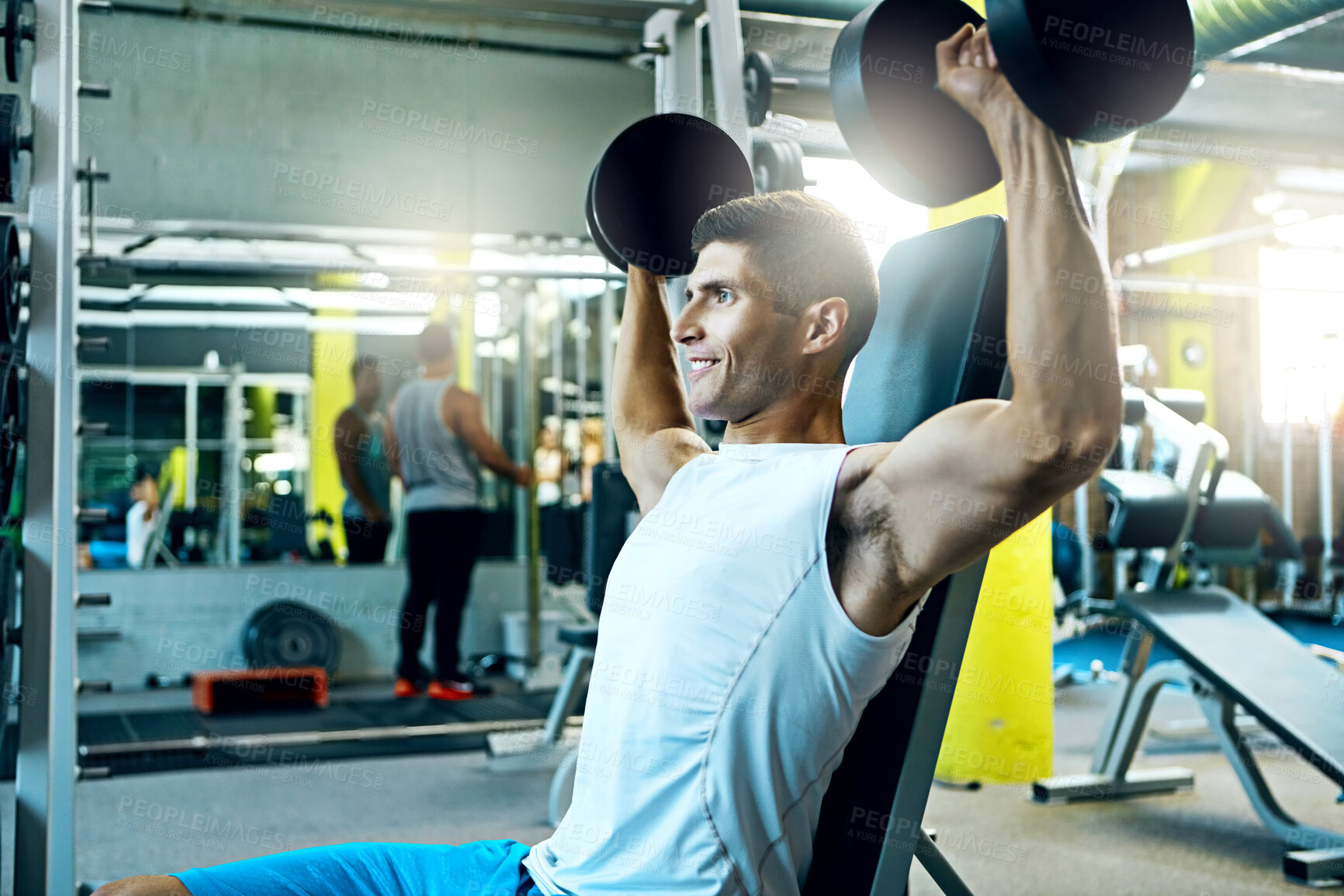 Buy stock photo Dumbbells, shoulder press and smile with man in gym for strength training or workout routine. Exercise, flare and weightlifting with happy bodybuilder in health club for challenge, fitness or power
