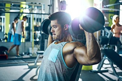 Buy stock photo Dumbbells, fitness and shoulder press with man in gym for strength training or workout routine. Exercise, flare and weightlifting with bodybuilder in health club for challenge, improvement or power