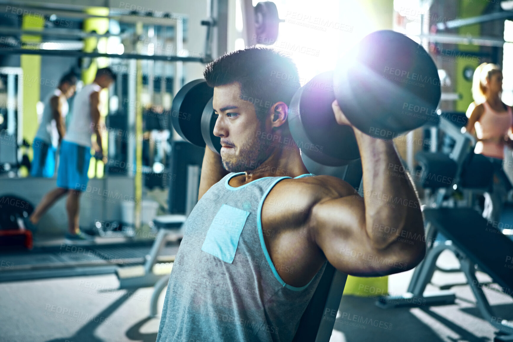 Buy stock photo Dumbbells, fitness and shoulder press with man in gym for strength training or workout routine. Exercise, flare and weightlifting with bodybuilder in health club for challenge, improvement or power