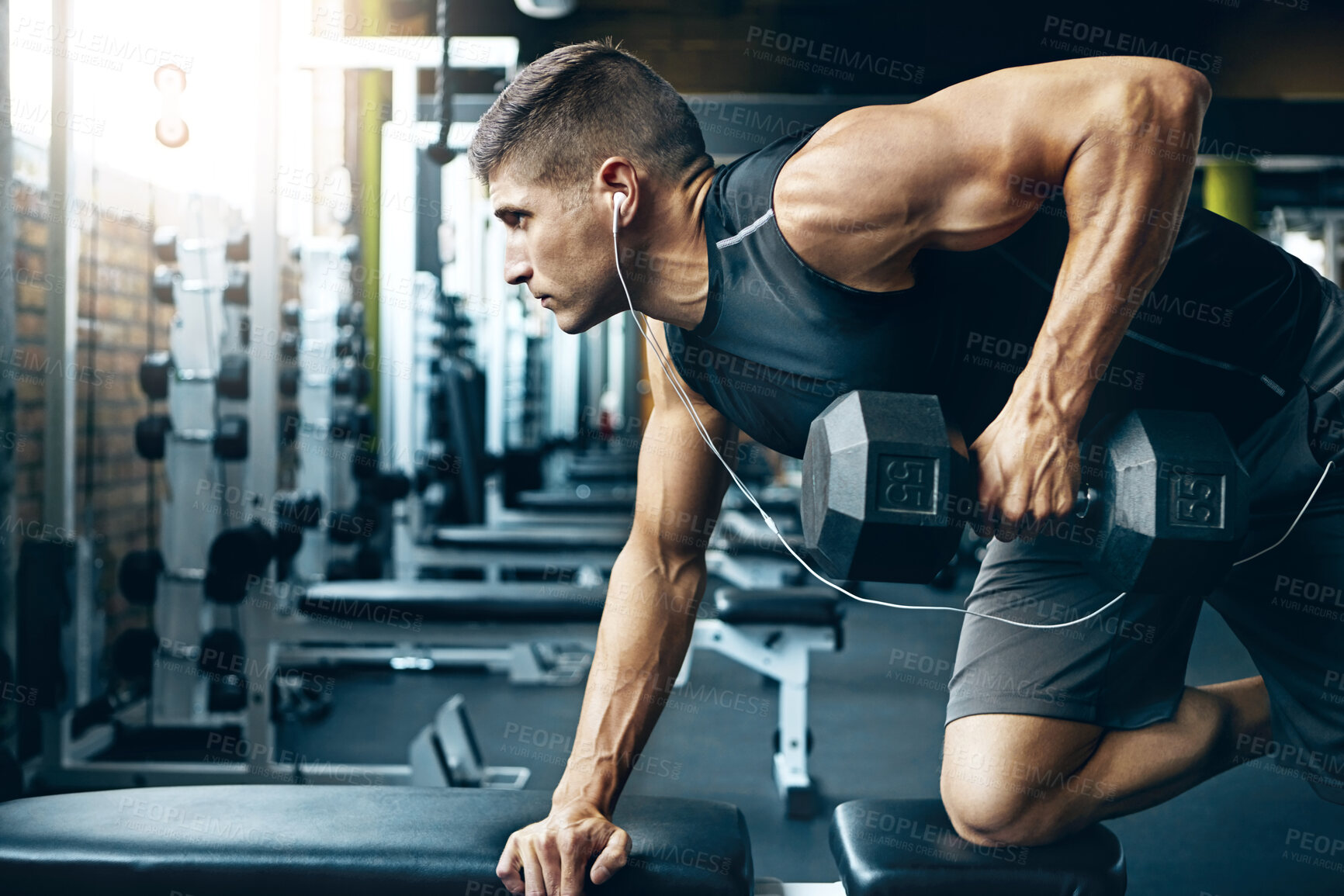 Buy stock photo Music, dumbbells and man in gym, fitness or endurance for body development. Equipment, weight lifting or person in wellness center, audio or strength training for muscle growth, challenge or exercise