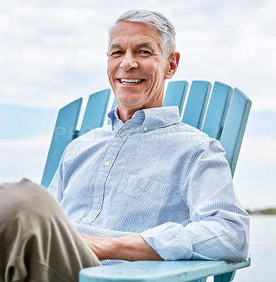 Buy stock photo Portrait, relax and smile of old man at lake in nature for holiday, retirement or vacation. Break, deck chair and travel with happy senior person outdoor for me time chilling, pause or unwind