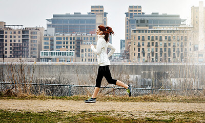 Buy stock photo Happy, woman and running for fitness outdoor for exercise, cardio training and morning routine. Thinking, female runner and sprint for challenge, endurance workout and performance of wellness in city