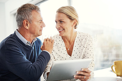 Buy stock photo Smile, couple and tablet with support in home for loan application, budget planning and finance. Trust, mature people and happy with tech in house for online banking, financial report or credit check