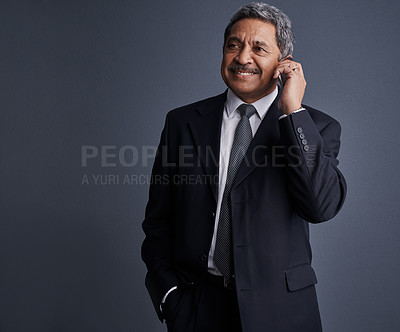 Buy stock photo Mature man, financial advisor and phone call in studio with smile, talk or space on dark background. Person, happy broker and smartphone with contact, feedback and consultation for investing