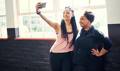 Buy stock photo Friends, bonding and women in gym, selfie or happy on break, fitness and online for social media app. Team, photography and people with smile for profile picture and relax after exercise routine
