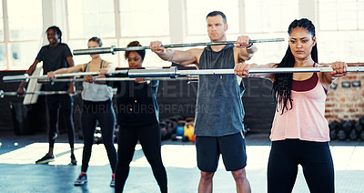 Buy stock photo Woman, group and weightlifting with steel bar at gym for strength training, fitness and class. Female instructor, people and muscle workout at health club for power challenge and functional exercise