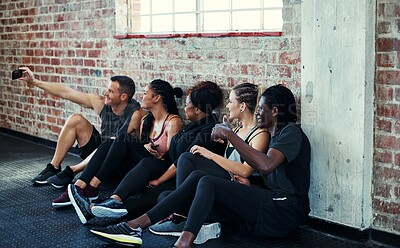 Buy stock photo Friends, selfie and break on gym floor for fitness, memory and bonding with post on web at wellness class. People, group and happy with photography, profile picture or social media at exercise club