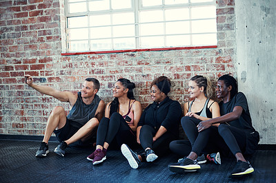 Buy stock photo Group, selfie and happy on gym floor for fitness, memory and bonding with post on web at wellness class. People, friends and smile with photography, profile picture or social media at exercise club