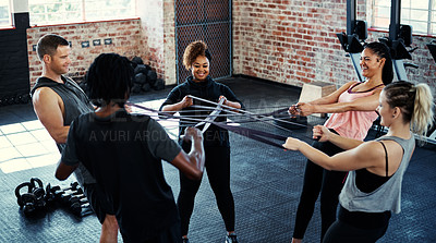 Buy stock photo Resistance band, fitness and people in gym for training, teamwork and challenge. Health benefits, men and women in wellness center, exercise and equipment for endurance, workout and power mindset