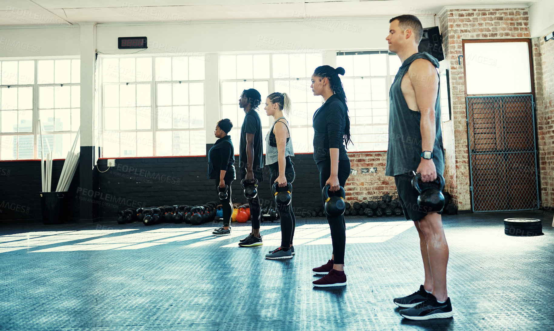 Buy stock photo Gym, training and people with kettlebell, exercise and bodybuilder with fitness routine for wellness. Health club, group and workout with equipment for muscle development, body care and strength