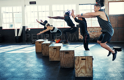 Buy stock photo Team, jump or people in fitness class with crate, cardio workout or calorie burn in balance training. Exercise, athletes or trainer with equipment, group session or intense lunge for weight loss.